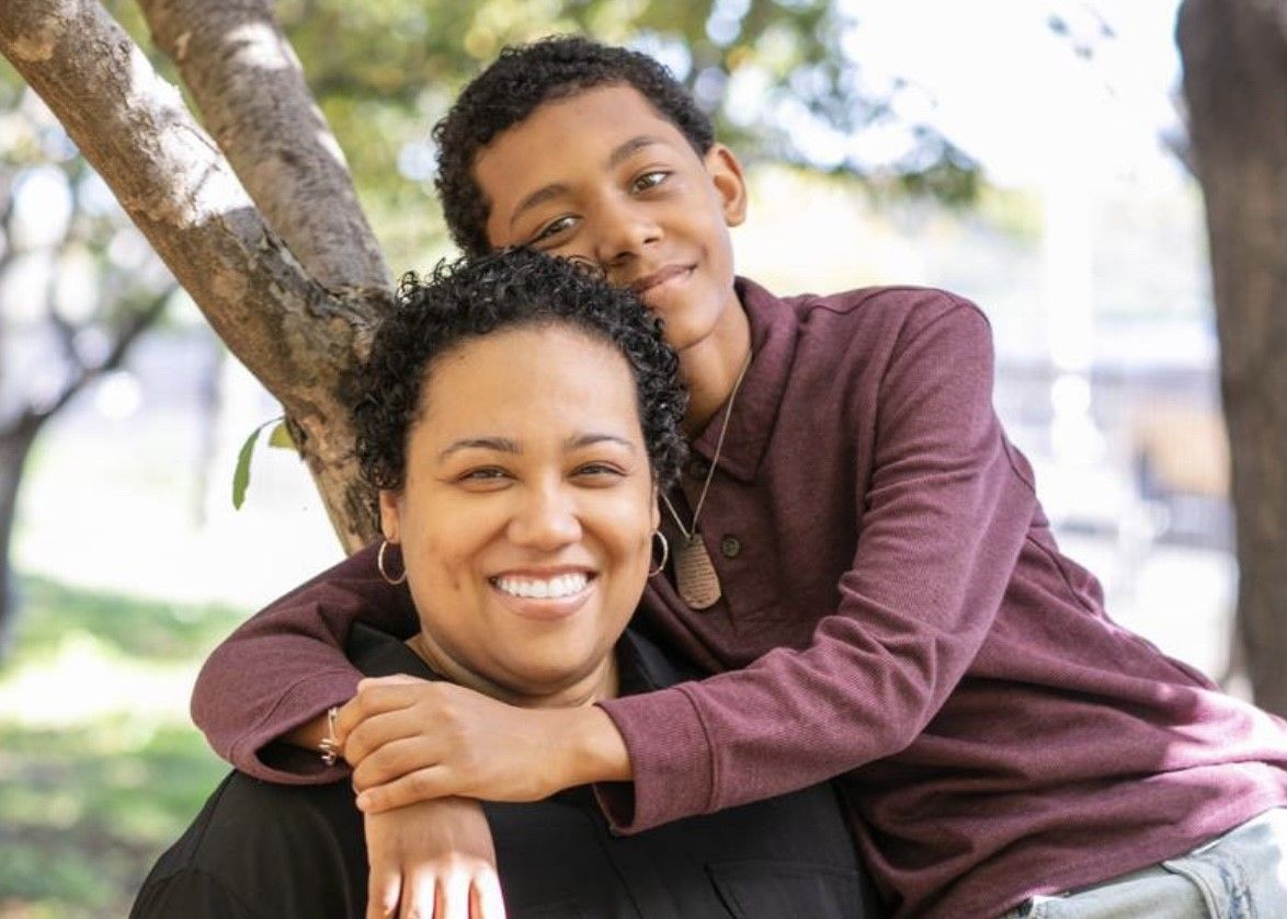 Mother and son hugging